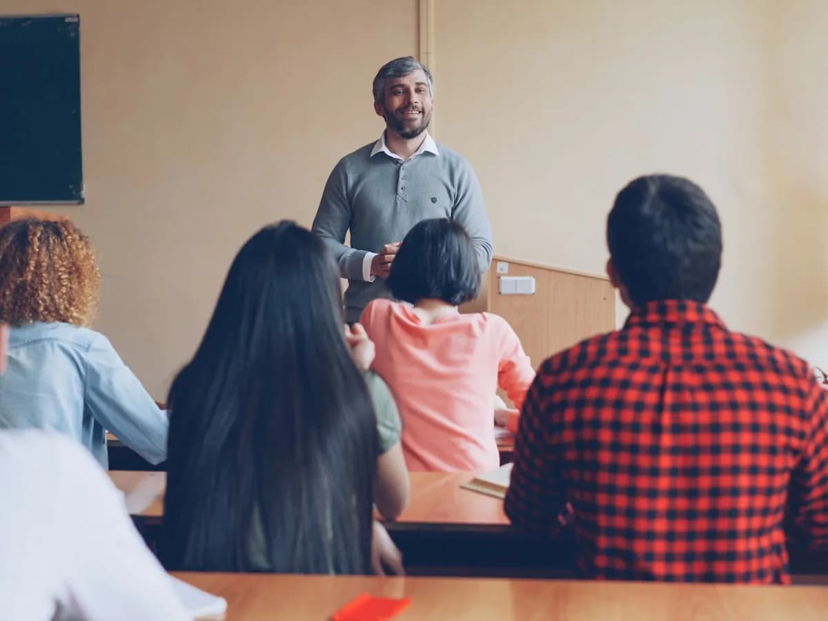 A teacher addressing a room of students